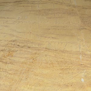 En produktbild på en gul guldig natursten med grå ådring till köksbänkskiva.