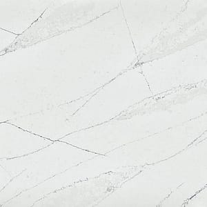 närbild på kompositsten, vit med grå ådring.